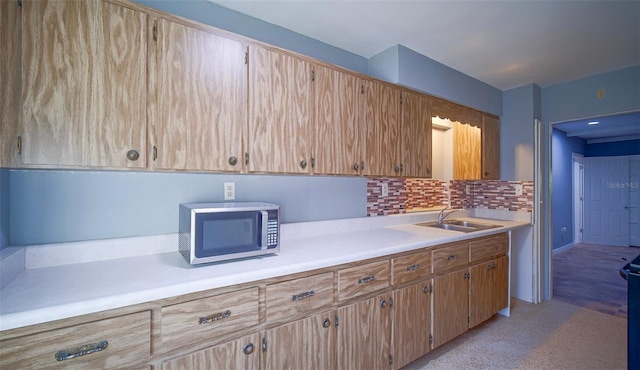1501 NE 57th St, Ocala, FL 34479 - kitchen with light countertops, stainless steel microwave, tasteful backsplash, and a sink