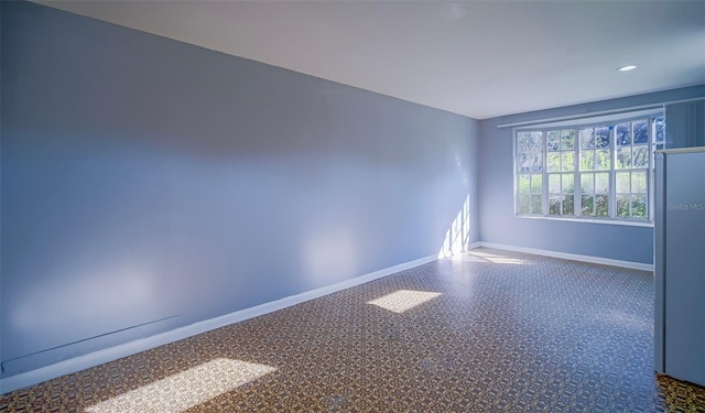 1501 NE 57th St, Ocala, FL 34479 - empty room with baseboards and recessed lighting