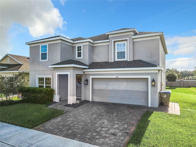 view of front facade featuring a front lawn and a garage