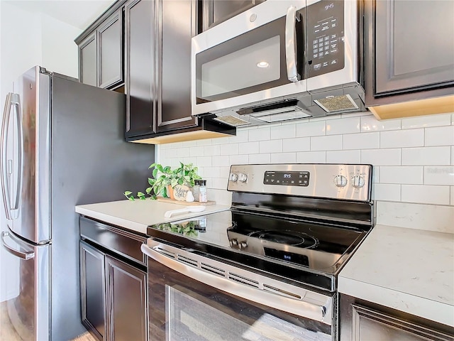 kitchen featuring decorative backsplash and stainless steel appliances