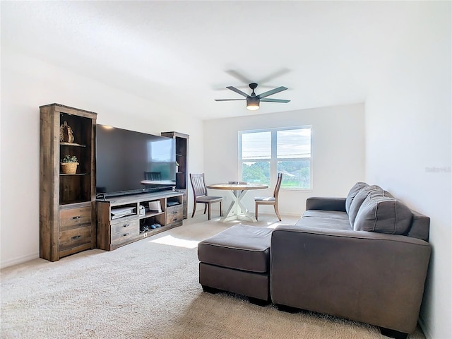 living room featuring ceiling fan and carpet