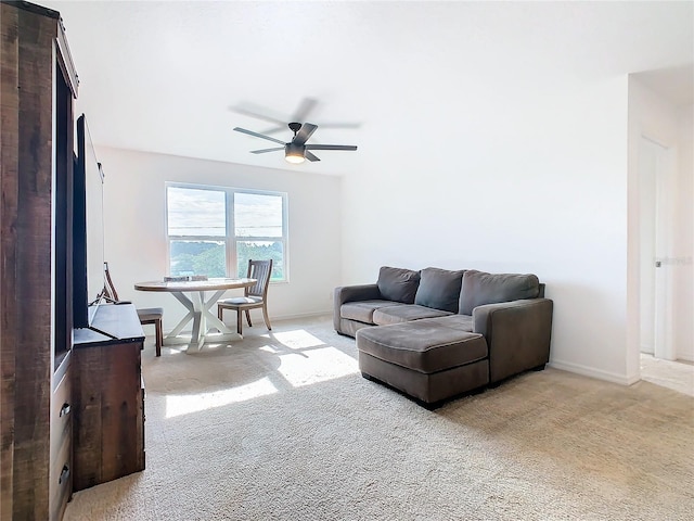 living room with ceiling fan and light carpet