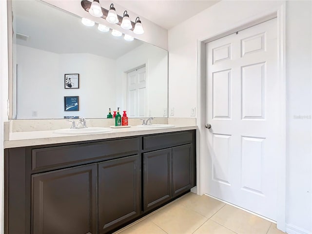 bathroom with vanity and tile patterned floors