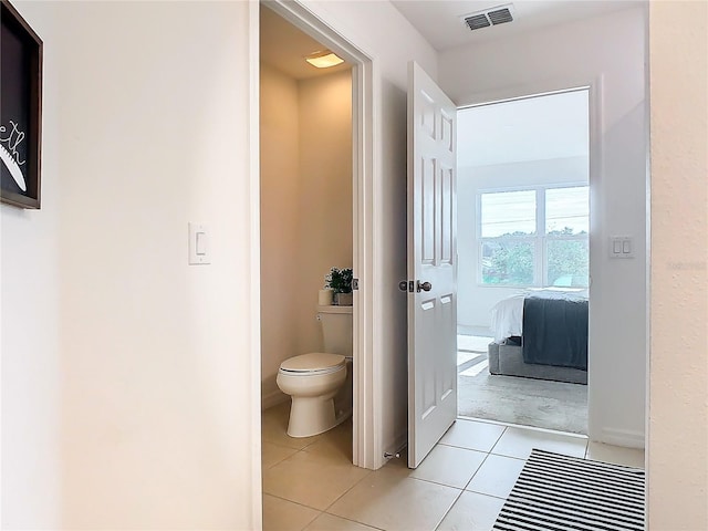 bathroom featuring tile patterned floors and toilet