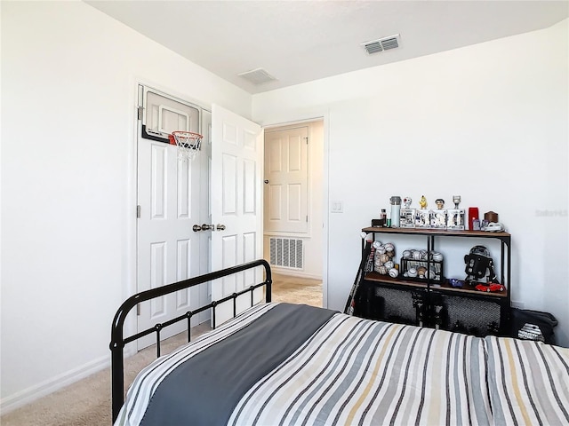 bedroom with light colored carpet