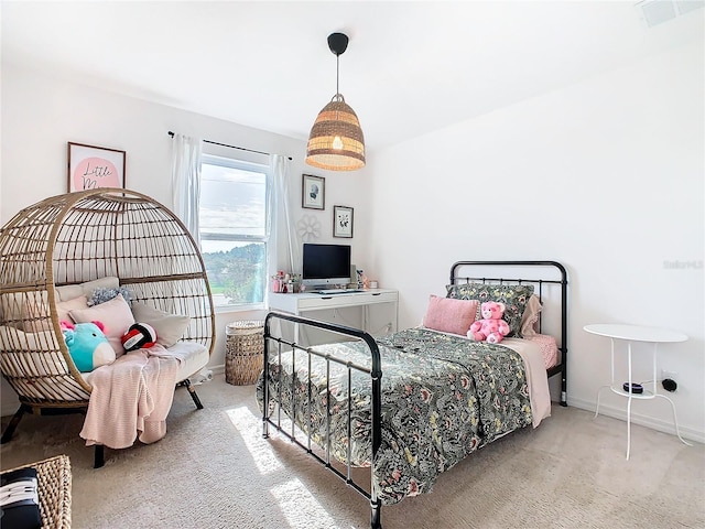 bedroom with light colored carpet