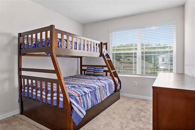 bedroom featuring light carpet