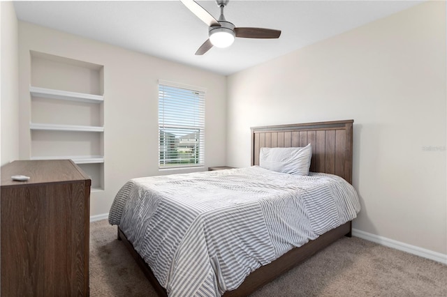 bedroom with ceiling fan and carpet floors