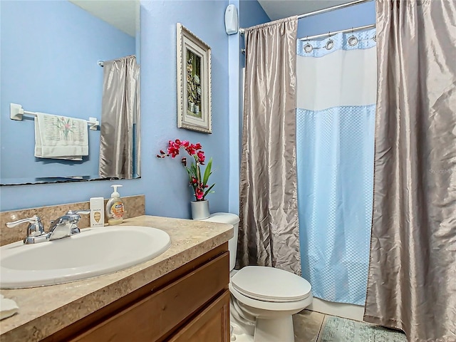 bathroom featuring tile patterned flooring, vanity, toilet, and a shower with shower curtain