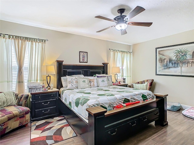 bedroom featuring hardwood / wood-style flooring and ceiling fan