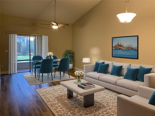 living room featuring high vaulted ceiling, hardwood / wood-style flooring, and ceiling fan