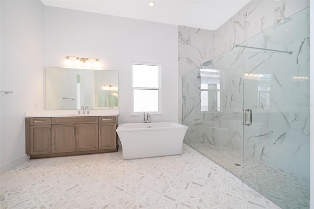 bathroom featuring vanity and shower with separate bathtub