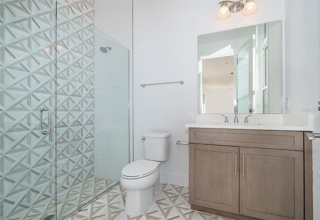 bathroom featuring an enclosed shower, vanity, and toilet