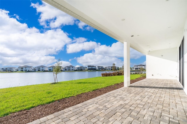 view of patio featuring a water view