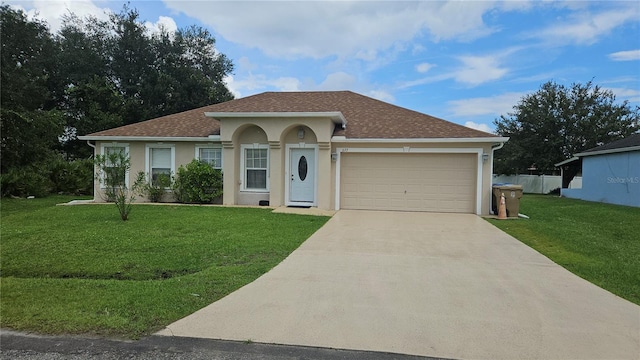 view of front of house featuring a garage and a front lawn