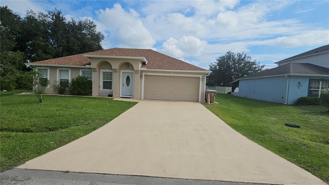 view of front of house with a garage and a front lawn