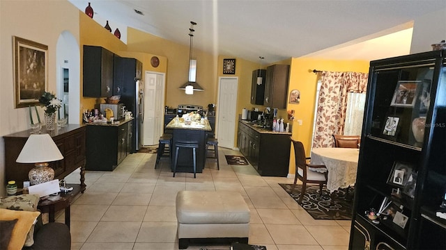 interior space featuring vaulted ceiling and sink