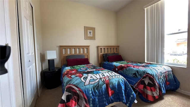 bedroom with a closet and carpet