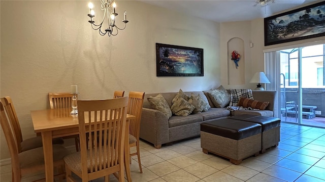 tiled living room featuring an inviting chandelier