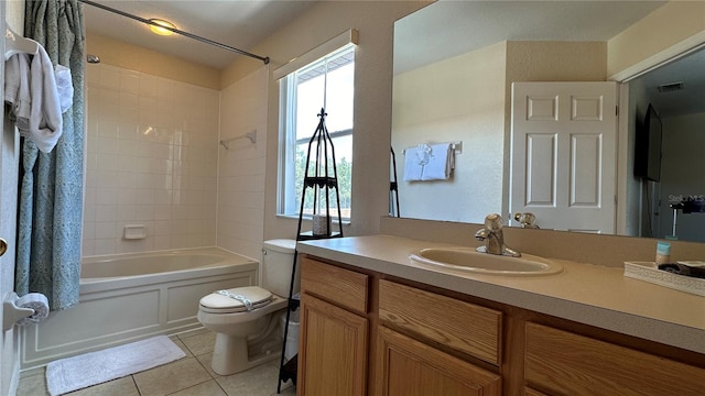 full bathroom with tiled shower / bath, vanity, tile patterned flooring, and toilet