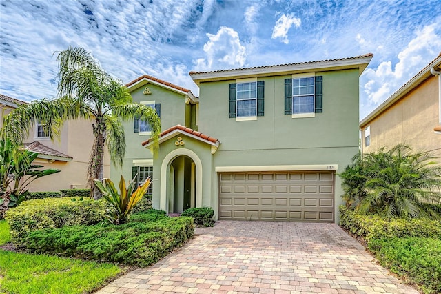 mediterranean / spanish-style home featuring a garage