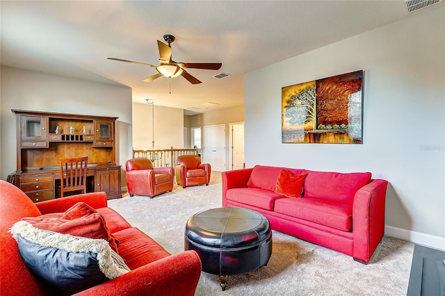 carpeted living room featuring ceiling fan