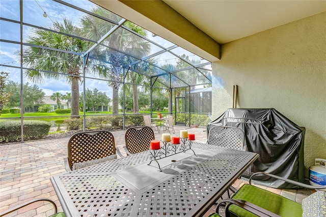 view of patio / terrace featuring a lanai