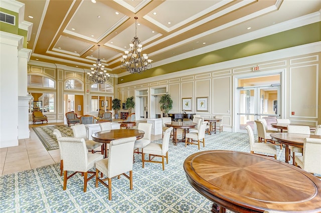 dining area with a towering ceiling, crown molding, coffered ceiling, and a notable chandelier