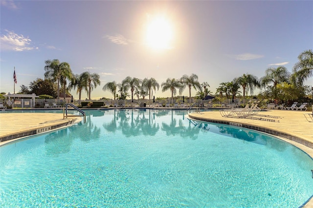 view of pool at dusk