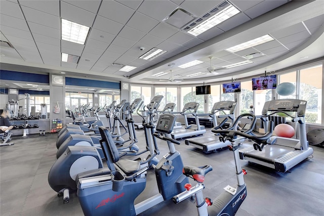 gym with a drop ceiling and ceiling fan