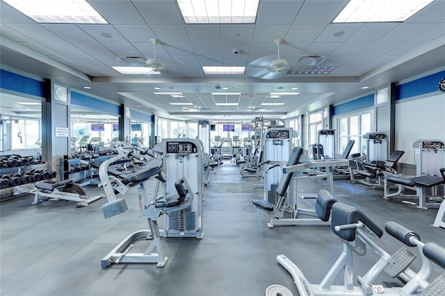 gym featuring a paneled ceiling and ceiling fan