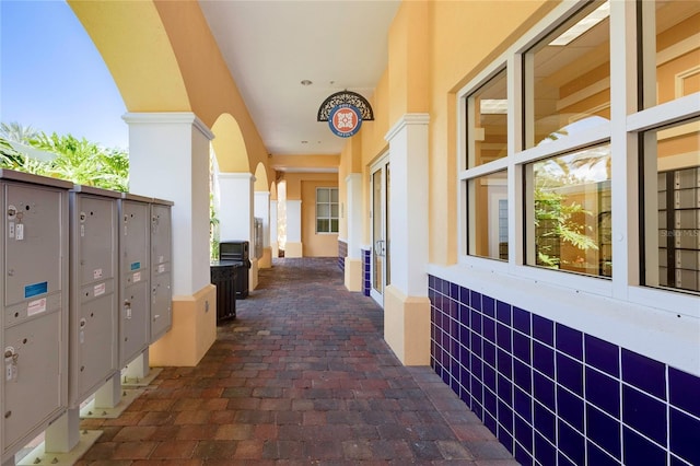 view of patio with a mail area