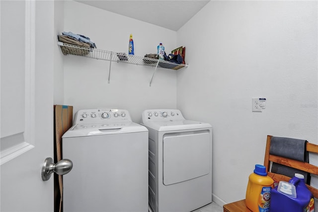 washroom with independent washer and dryer