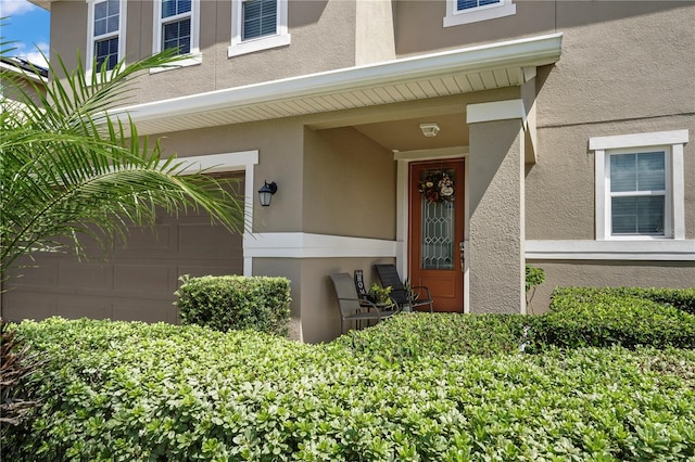 doorway to property featuring a garage