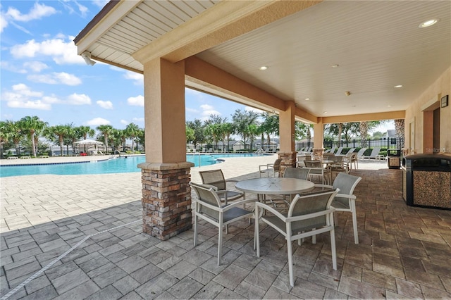 view of patio with a community pool