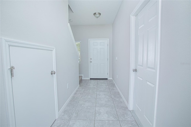 hallway with light tile patterned floors