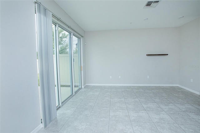 view of tiled spare room