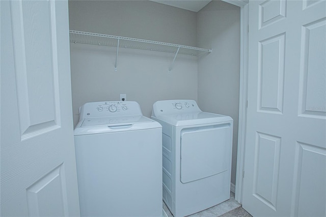 laundry room with washer and dryer