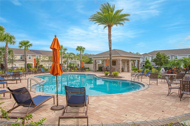 view of swimming pool with a patio area