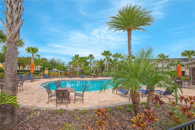 view of swimming pool with a patio area