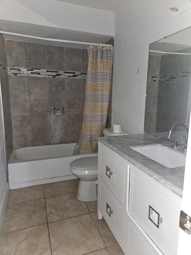 full bathroom with shower / tub combo with curtain, vanity, toilet, and tile patterned floors