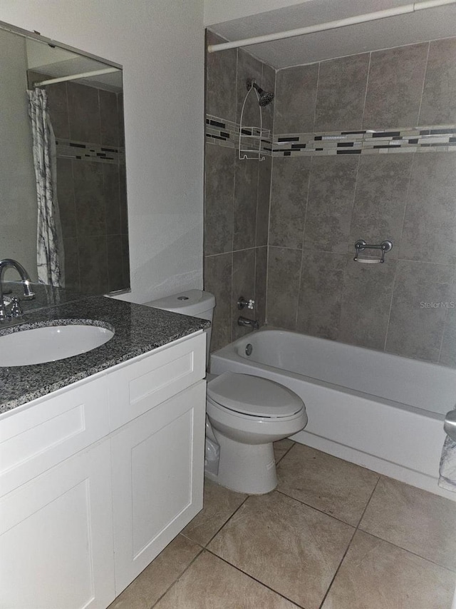 full bathroom with vanity, tile patterned flooring, toilet, and shower / bathtub combination with curtain