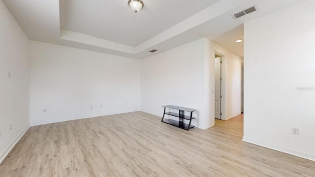 spare room with light hardwood / wood-style floors