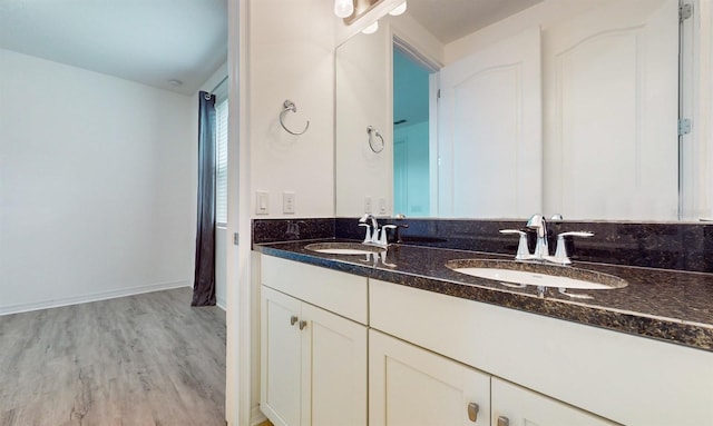 bathroom with vanity and wood-type flooring