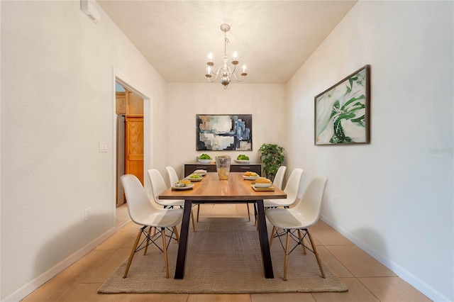 tiled dining space with an inviting chandelier