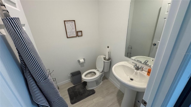 bathroom with toilet and sink