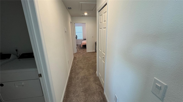 hallway featuring carpet floors and washer / clothes dryer