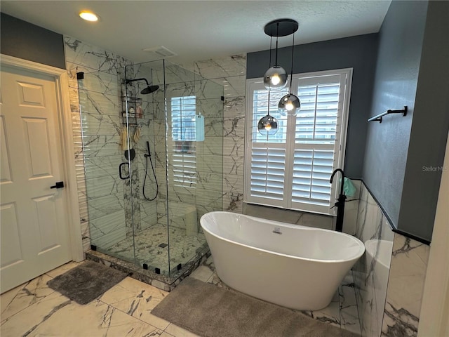 bathroom with separate shower and tub