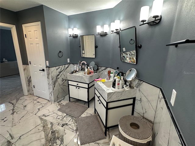 bathroom featuring tile walls and vanity