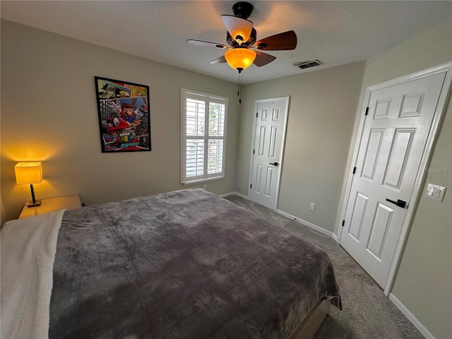 bedroom featuring ceiling fan and carpet flooring